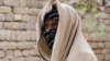 A nineteen-year-old Taliban deserter hides his face in Kunduz Province. “I faced the darkest moment of my life seeing my brother's body covered with blood and dust,” he said.