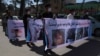 Afghans shout slogans outside the Iranian consulate in Herat on May 11 during a protest to demand justice for Afghans allegedly killed by the Iranian security forces.