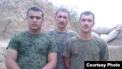 The three soldiers say they were forced to use their own money to buy construction materials for repairs to their barracks.