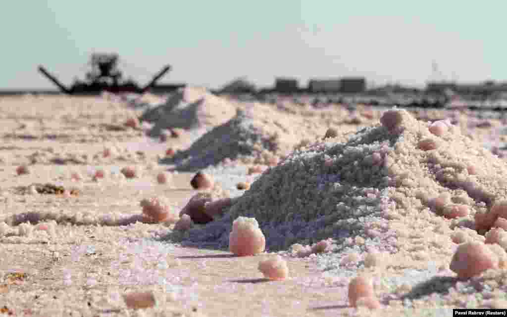 A salt harvester collects the mineral on the shores of the lake.&nbsp;