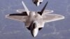 U.S. -- (FILES) This US Air Force file image shows two F/A-22A Raptor fighters in trailing formation in route to Hill AFB, Utah on October 15, 2005 for Combat Hammer exercise. CNN Reported on March 25, 2009 that an F-22A crashed near Edwards Air Force Bas