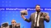 Member of Syrian armed opposition, former officer of the Syrian army, now an opposition, Yasir Abdur Rakhim (R) speaks as he demonstrates photo documents, during a press conference after the seventh round of talks on the Syrian conflict.