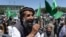An Afghan demonstrator shouts slogans in support of presidential candidate Abdullah Abdullah in Kabul on June 22. With allegations of fraud circulating, some lawmakers feel social media may be fanning the flames of tension surrounding the hotly contested election. 