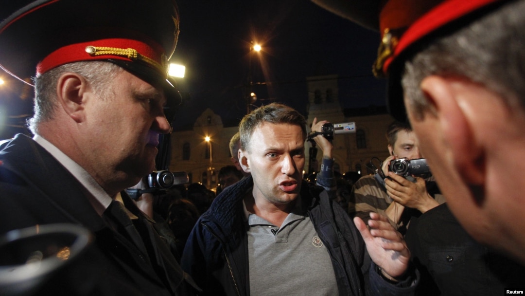 Blogger and activist Aleksei Navalny talks to police officers during a rally in central Moscow on May 8.
