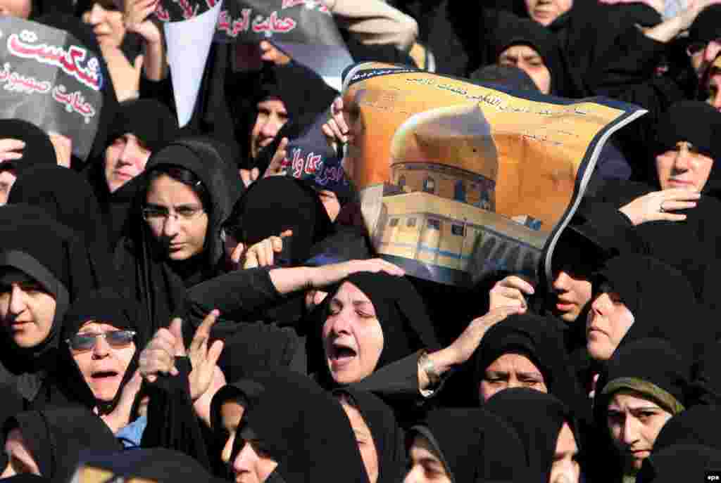 Iranian women show their anger at the bombing of a Shi'ite shrine in Samarra in neighboring Iraq (epa) - The drumbeat of violence in Iraq quickened and changed in February. With a devastating explosion in Samarra's Golden Mosque and its Shi'ite shrine, the sectarian dimension of much of the violence became clearer and more important. The daily list of deaths became longer, the refugee camps swelled, talk of civil war became louder, and optimists became fewer.