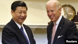 Joe Biden (s) we Ksi Jinping (ç)