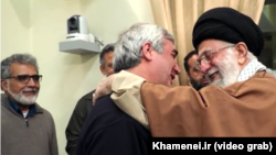 A screen grab from a recent propagandistic video that supposedly shows Supreme Leader Ayatollah Ali Khamenei (right) chatting amiably with artists and filmmakers in a "warm" and "friendly" atmosphere. 