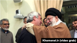 A screen grab from a recent propagandistic video that supposedly shows Supreme Leader Ayatollah Ali Khamenei (right) chatting amiably with artists and filmmakers in a "warm" and "friendly" atmosphere. 