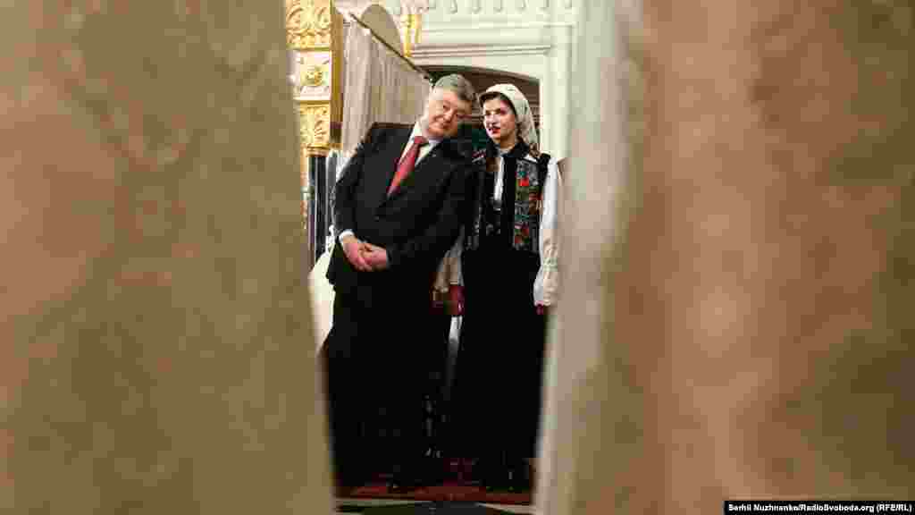 President Poroshenko and his wife Maryna observe the ceremony.