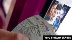 A man holds tickets for a screening of Matilda at the Illyuzion cinema in Vladivostok on September 11.