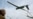FILE PHOTO: A Ukrainian servicemember looks at a reconnaissance drone as it launches from a position near the front line at an undisclosed location in southern Ukraine on an undisclosed date in 2026.