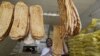 An Iranian baker shows a traditional bread, known locally as "Barbari", during the Muslim holy month of Ramadan, in Tehran, June 22, 2016. File photo
