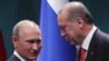 Turkish President Recep Tayyip Erdogan (R) and Russian President Vladimir Putin shake hands after a joint press conference following their meeting in Ankara, September 28, 2017