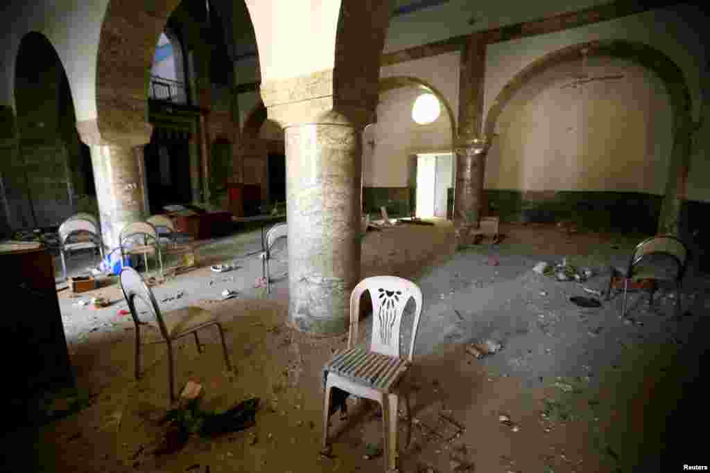 An explosive belt is seen on a chair in the town of Bashiqa, Iraq, after it was recaptured from the Islamic State extremist group, east of Mosul, on November 9. (Reuters/Thaier Al-Sudani)