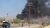FILE: Smoke rises from the site of an attack in Gardez, the capital of southeastern Paktia Province.