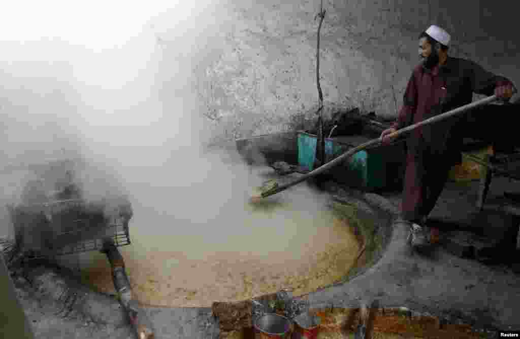 A man makes sweets at a traditional factory in Jalabadad, Afghanistan. (Reuters/Parwiz)