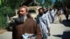 Taliban prisoners walk in line before their release from Bagram prison in the northern province of Parwan on May 26.