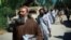 Taliban prisoners walk in line before their release from Bagram prison in the northern province of Parwan on May 26.