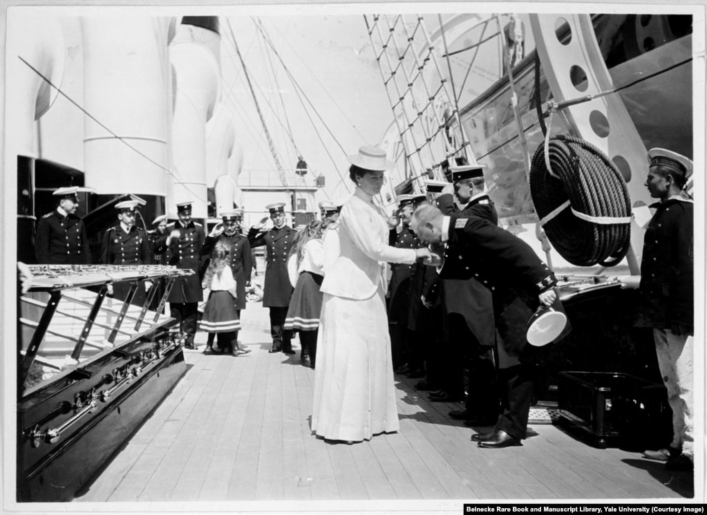 Empress Aleksandra being greeted aboard the Standart, the imperial yacht that served the tsar&#39;s family for holidays and official tours. In the background, her young daughters, known as Russia&#39;s grand duchesses, are saluted by the crew.