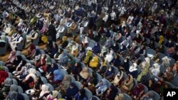 Delegates attend the first day of the Loya Jirga in Kabul on August 7.