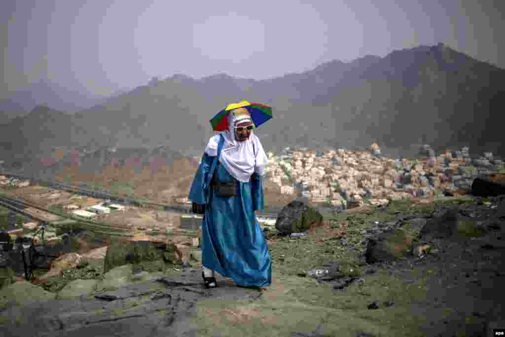 A woman climbs to the top of Mount Al-Noor ahead of the hajj in the holy city of Mecca, Saudi Arabia. Muslims believe the Prophet Muhammad received the first words of the Koran at the top of Mount Al-Noor. The hajj pilgrimage takes place in Mecca from September 9-14. (epa/Fazry Ismail)