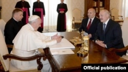 Pope Francis (left) meets with a delegation from Belarus led by President Alyaksandr Lukashena (right) in the Vatican on May 21.