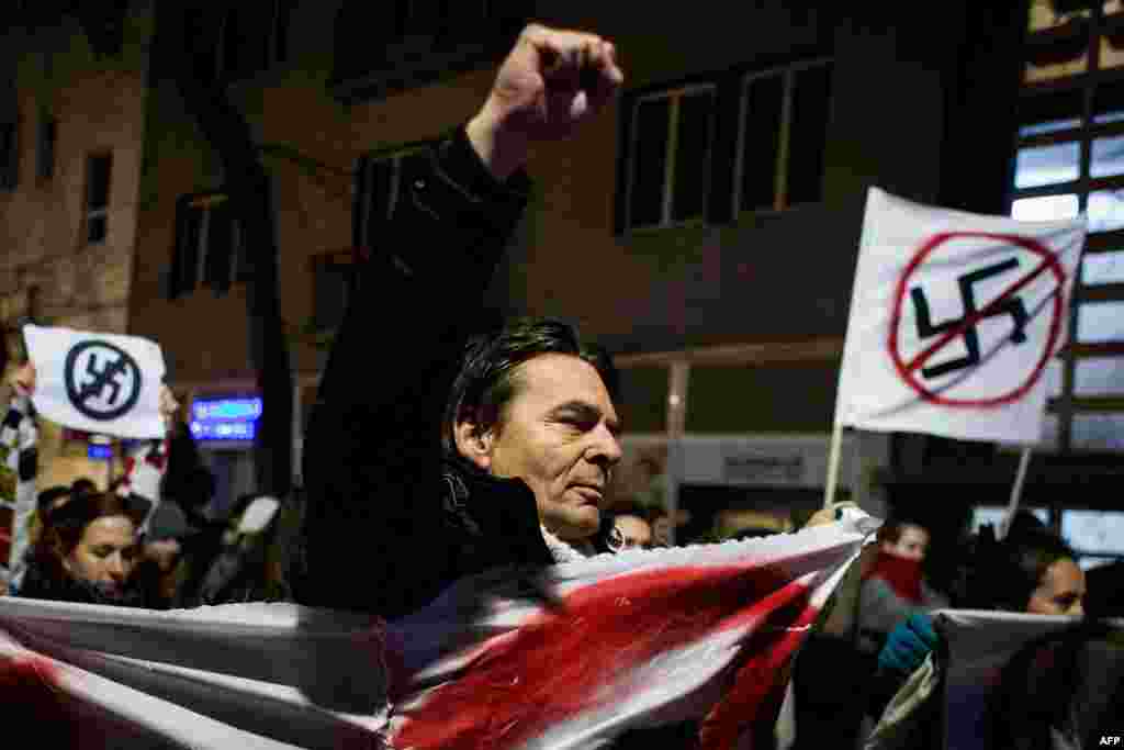 People take part in an anti-extreme-right rally in Bratislava in reaction to the results of parliamentary elections in Slovakia on March 7. (AFP/Vladimir Simicek)