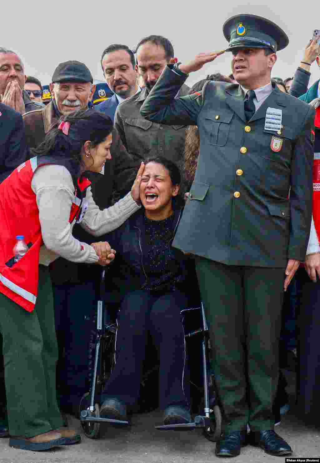 Relatives of Turkish army officer Umit Unce grieve during his funeral in Ankara. Unce was one of 20 killed when a military aircraft crashed into Georgian territory minutes after taking off from Azerbaijan on November 11. Investigations into the crash are ongoing.Photo by Efekan Akyuz/Reuters.