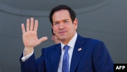 US Secretary of State Marco Rubio boards a US Air Force transport aircraft as he leaves Bahrain on June 25.