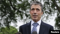 NATO Secretary-General Anders Fogh Rasmussen speaks with reporters after meeting with President Barack Obama at the White House in Washington on May 9.