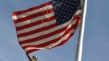 KOSOVO -- The US flag flies at half-mast next to the statue of former U.S. President Bill Clinton in Pristina, September 11, 2017