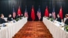 U.S. Secretary of State Antony Blinken (second right) and national-security advisor Jake Sullivan (right) speak while facing Yang Jiechi (second left), a Politburo member and Chinese leader Xi Jinping’s most senior envoy, and Foreign Minister Wang Yi (left) at the opening session of U.S.-China talks in Alaska on March 18.