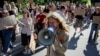 Protesters gather near the parliament building in Kyiv on August 19 to voice their anger over Ukrainian President Volodymyr Zelenskyy's decision last month to fire Defense Minister Mykhaylo Fedorov. 