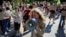 Protesters gather near the parliament building in Kyiv on August 19 to voice their anger over Ukrainian President Volodymyr Zelenskyy's decision last month to fire Defense Minister Mykhaylo Fedorov. 