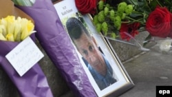 A photograph of policeman Keith Palmer, who was killed in the terror attack, is placed on Whitehall with flowers in central London on March 23.