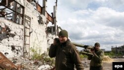 Українські військові на шахті «Бутівка», однієї з тих, що зазнали обстрілу 29 липня, архівне фото