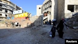 Люди залишають контрольовану повстанцями східну частину Алеппо, Сирія, 9 грудня 2016 року