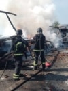 Firefighters extinguish a fire at the site of a drone attack in the Dnipropetrovsk region on May 3.