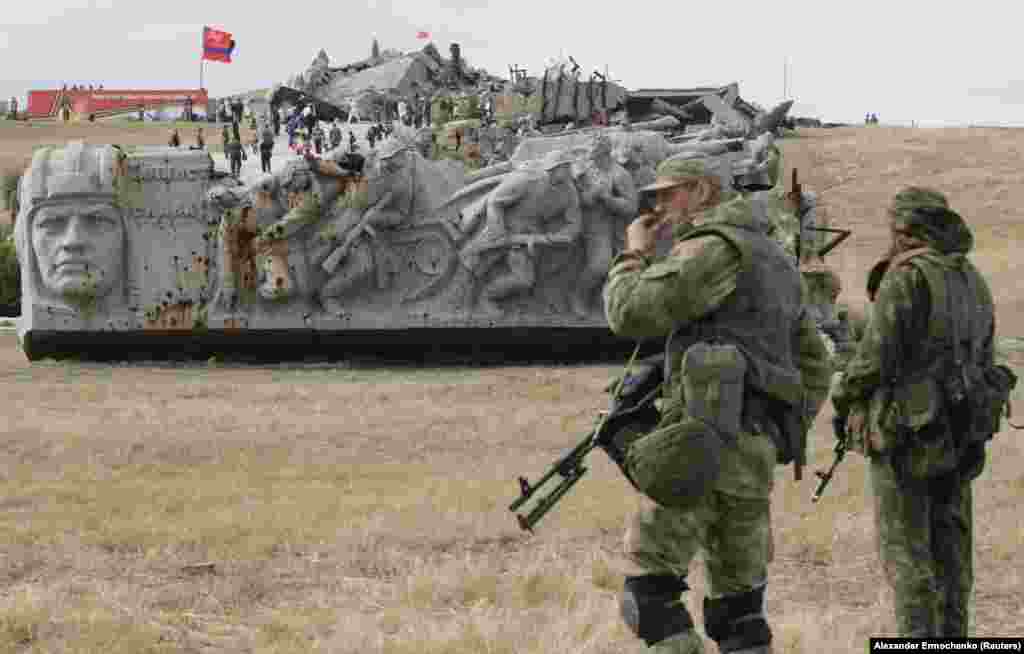 Separatist fighters of the Donetsk region stand guard during a ceremony marking the 75th anniversary of the liberation of the Donbas region from Nazi occupation during World War II, near the war memorial complex Savu on September 7. (Reuters/Aleksandr Yermochenko)