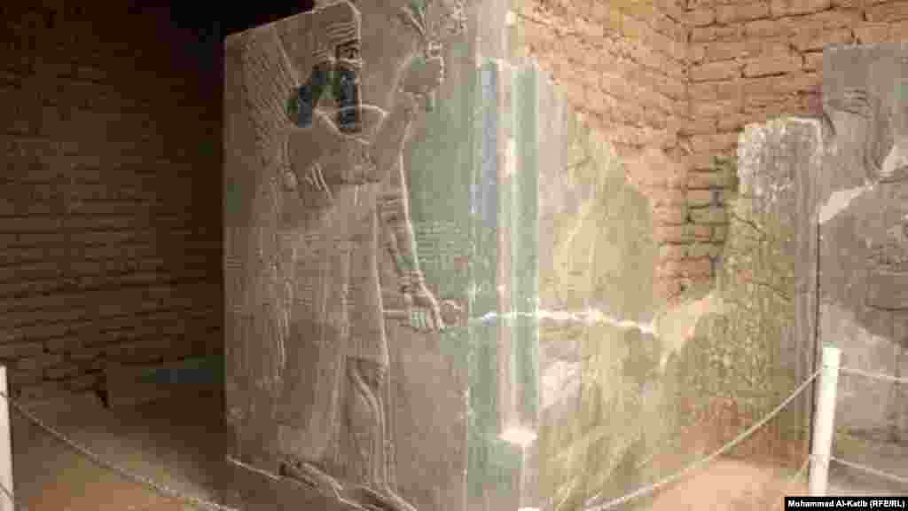 A stela -- a carved or inscribed stone slab or pillar used for commemorative purposes -- in the ancient Assyrian city of Nimrud featuring a relief of an Assyrian king or deity. This and the following photos were taken by RFE/RL&#39;s Radio Free Iraq in 2012.