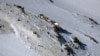 The wreckage of a plane that crashed near a mountain peak in Iran's Zagros mountain range, February 20, 2018