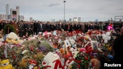Foreign ambassadors lay flowers at a memorial for the victims of the attack at Crocus City Hall in Moscow on March 30.