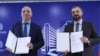 Armenia - Economy Minister Gevorg Papoyan (right) and Lydian Armenia CEO Hayk Aloyan sign a share transfer agreement in Yerevan, December 27, 2024.