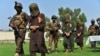 Afghan security personnel escort arrested alleged Islamic State militants during an operation in Jalalabad Province in October 2019.
