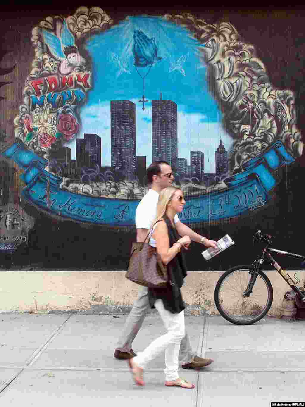 Near Ground Zero, a less official memorial in the form of a street mural shows the Twin Towers.