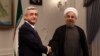 Iran -- Armenian President Serzh Sarkisian (L) meets with Iran's new President Hasan Rohani (R) at his office in Tehran on August 5, 2013.