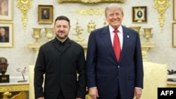 Ukrainian President Volodymyr Zelenskyy and US President Donald Trump pose for a photo during a meeting at the White House in Washington on July 28.