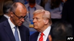 Germany’s Chancellor Friedrich Merz (L) speaks with US President Donald Trump at a North Atlantic Treaty Organization (NATO) summit in The Hague last year. (file photo)