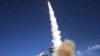 A missile is launched from the Aegis-combat-system-equipped destroyer "USS Decatur" during a Missile Defense Agency ballistic-missile flight test in 2007.