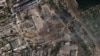 Наслідки удару ЗСУ по російських складах боєприпасів в окупованій Новій Каховці на Херсонщині, що був здійснений увечері 11 липня. Супутниковий знімок Planet Labs PBC від 12 липня 2022 року